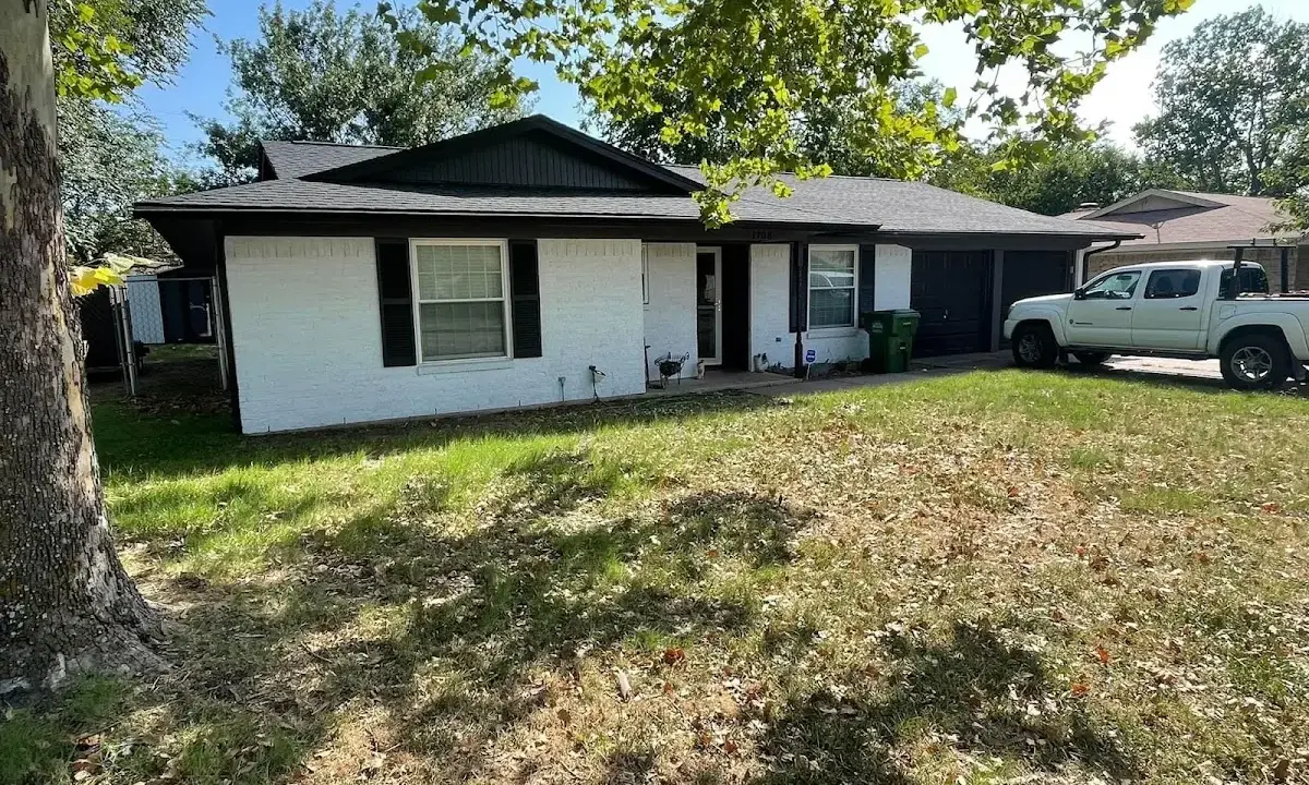 Professional roofing crew working on a residential roof in West Chester